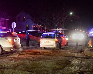 Youngstown police and crime scene personnel oversee the start of a shooting investigation late Saturday on Summer Street on the South Side.