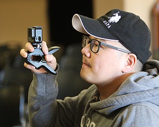             ROBERT  K. YOSAY | THE VINDICATOR..The 85th Spellling Bee at YSU and Kilcawley Center - 44 spellers came  down to  Mackenzie Sambroak 5th grader from Roosevelt Elementary in McDonald...Yu Zeng creates a moment with his GO PRO his soneJay Zheng --BL Miller  school