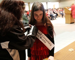             ROBERT  K. YOSAY | THE VINDICATOR..The 85th Spellling Bee at YSU and Kilcawley Center - 44 spellers came  down to  Mackenzie Sambroak 5th grader from Roosevelt Elementary in McDonald...Karen Donald Campbell Elementary and Middle -  gets her banner form her mom Michele