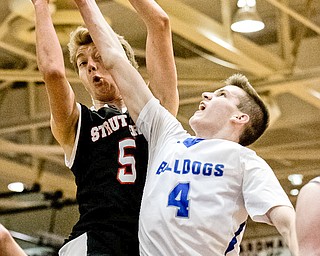 Struthers' Carson Ryan and Lakeview's TJ Lynch battle for a rebound during Lakeview's 72-59 victory during the Division II District Title game in Boardman on Saturday...Photo by Dianna Oatridge