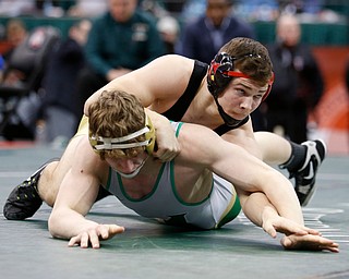 Canfield's David Crawford, top, works against St. Vincent-St. Mary's David Heath in a 182 pound championship match during the Division II Ohio state wrestling tournament at the Ohio State University Saturday, March 10, 2018. Crawford won 5-3. (Photo by Paul Vernon)