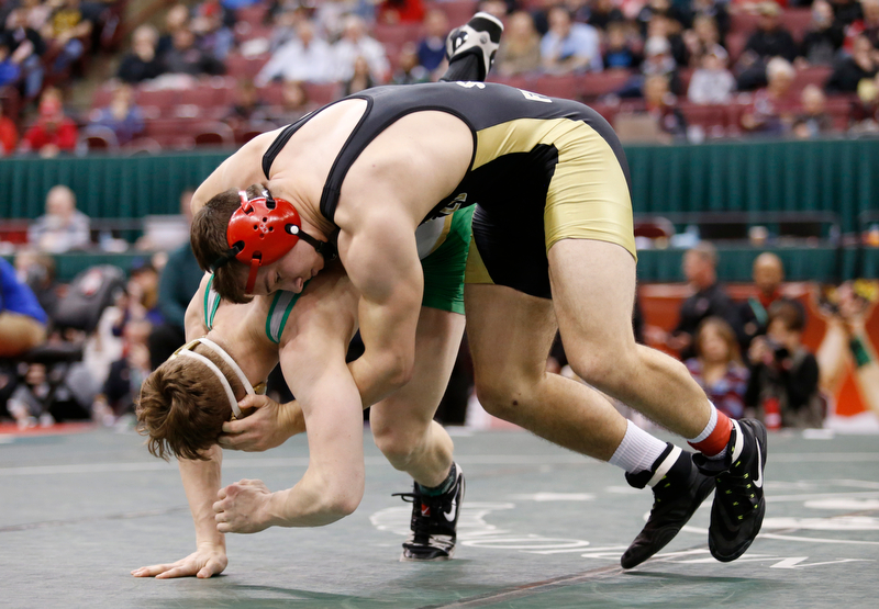 Canfield's David Crawford, top, works against St. Vincent-St. Mary's David Heath in a 182 pound championship match during the Division II Ohio state wrestling tournament at the Ohio State University Saturday, March 10, 2018. Crawford won 5-3. (Photo by Paul Vernon)