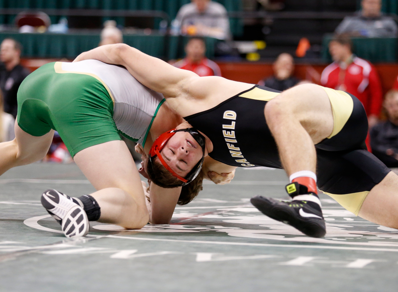 Canfield's David Crawford, right, works against St. Vincent-St. Mary's David Heath in a 182 pound championship match during the Division II Ohio state wrestling tournament at the Ohio State University Saturday, March 10, 2018. Crawford won 5-3. (Photo by Paul Vernon)