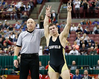 Canfield's David Crawford, right, is declared the winner over St. Vincent-St. Mary's David Heath in a 182 pound championship match during the Division II Ohio state wrestling tournament at the Ohio State University Saturday, March 10, 2018. Crawford won 5-3. (Photo by Paul Vernon)