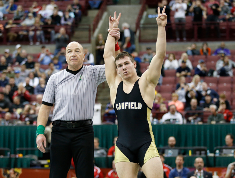 Canfield's David Crawford, right, is declared the winner over St. Vincent-St. Mary's David Heath in a 182 pound championship match during the Division II Ohio state wrestling tournament at the Ohio State University Saturday, March 10, 2018. Crawford won 5-3. (Photo by Paul Vernon)
