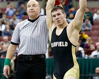 Canfield's David Crawford, right, is declared the winner over St. Vincent-St. Mary's David Heath in a 182 pound championship match during the Division II Ohio state wrestling tournament at the Ohio State University Saturday, March 10, 2018. Crawford won 5-3. (Photo by Paul Vernon)