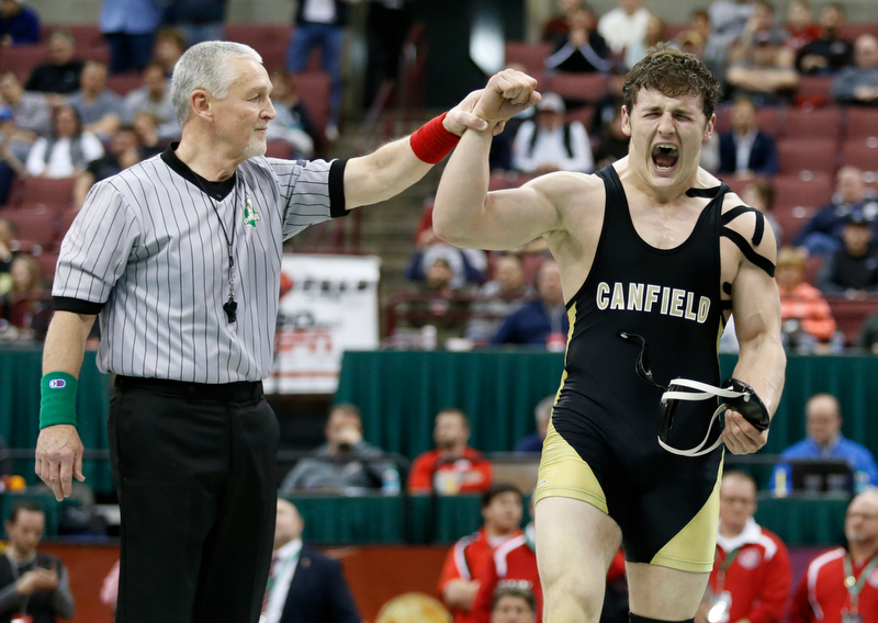 Canfield's Tyler Stein, right, is declared the winner of his 220 pound championship match win over Maumee's Brandon Phillips during the Division II Ohio state wrestling tournament at the Ohio State University Saturday, March 10, 2018. Stein won 7-3. (Photo by Paul Vernon)