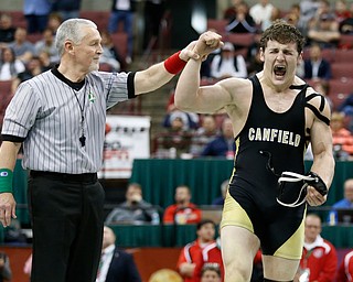 Canfield's Tyler Stein, right, is declared the winner of his 220 pound championship match win over Maumee's Brandon Phillips during the Division II Ohio state wrestling tournament at the Ohio State University Saturday, March 10, 2018. Stein won 7-3. (Photo by Paul Vernon)