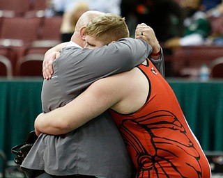 Girard's Jack DelGarbino, left, hugs his father J.T. DelGarbino after his pin on Steubenville's Tyler Ely in a 285 pound championship match during the Division II Ohio state wrestling tournament at the Ohio State University Saturday, March 10, 2018. (Photo by Paul Vernon)