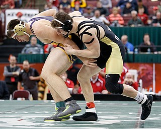 Canfield's Tyler Stein, right, works against Maumee's Brandon Phillips in a 220 pound championship match during the Division II Ohio state wrestling tournament at the Ohio State University Saturday, March 10, 2018. Stein won 7-3. (Photo by Paul Vernon)