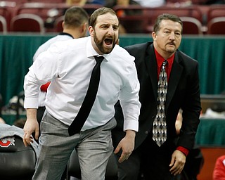 Canfield's coaches Steve Pitts, left, and David Crawford direct Tyler Stein during his 220 pound championship match against Maumee's Brandon Phillips during the Division II Ohio state wrestling tournament at the Ohio State University Saturday, March 10, 2018. Stein won 7-3. (Photo by Paul Vernon)