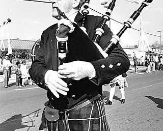 KILTED CLEVELANDER: Jim Martin of the West Side Irish-American Club of Cleveland was among the bagpipers who participated in Sunday's parade...Photo taken on March 10, 1985...Photo by Robert K. Yosay.