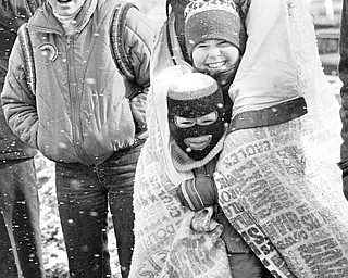 The Irish eyes of the Fitzgerald family of Pittsburgh kept smiling despite snow flurries and 20-25mph winds.  From bottom are Kenny, 6; Heather, 11; and Ruth Fitzgerald.  Robin, 14, is at her left...Photo taken March 11, 1984...Photo is by Robert K. Yosay - The Vindicator.