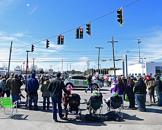 BOARDMAN, OHIO - MARCH 11, 2018: People stand along Market Street during the Mahoning Valley St. Patrick's Day Parade. DAVID DERMER | THE VINDICATOR