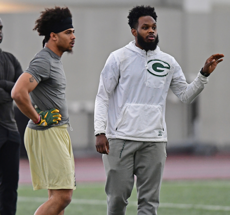 YOUNGSTOWN, OHIO - MARCH 13, 2018: Green Bay Packers scout and former YSU defensive back Brandian Ross, gives instructions to Jalyn Powell and other defensive backs during individual drills during the Youngstown State football pro day, Tuesday morning at the Watts Indoor Facility. DAVID DERMER | THE VINDICATOR