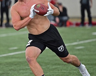 YOUNGSTOWN, OHIO - MARCH 13, 2018: Youngstown State's Kevin Rader turns upfield after catching a pass during individual drills during the Youngstown State football pro day, Tuesday morning at the Watts Indoor Facility. DAVID DERMER | THE VINDICATOR