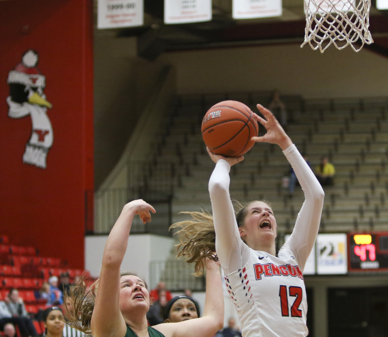  ROBERT K.YOSAY  | THE VINDICATOR..YSU #12  Chelesa Olson fights for two during third quarter action - as Binghamton#31 Corrin Godshall looks on after Chelesa drove through -..YSU Women went down to defeat against Binghamton 70-59  but not without a fight- The Penguins led by at least 10 at some point in the first half..-30-