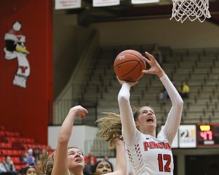  ROBERT K.YOSAY  | THE VINDICATOR..YSU #12  Chelesa Olson fights for two during third quarter action - as Binghamton#31 Corrin Godshall looks on after Chelesa drove through -..YSU Women went down to defeat against Binghamton 70-59  but not without a fight- The Penguins led by at least 10 at some point in the first half..-30-