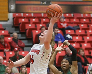  ROBERT K.YOSAY  | THE VINDICATOR..YSU #34 McKenah Peters  as Binghamton#11 Alexus Burkhart  tried to defend Second quarter action.. does a one handed layup YSU Women went down to defeat against Binghamton 70-59  but not without a fight- The Penguins led by at least 10 at some point in the first half..-30-