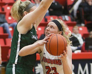  ROBERT K.YOSAY  | THE VINDICATOR..YSU#23 Sarah Cash looks under the outstretched arms of Binghamton#50 Kaylee Wascod during second quarter action as Sarah put in2..YSU Women went down to defeat against Binghamton 70-59  but not without a fight- The Penguins led by at least 10 at some point in the first half..-30-