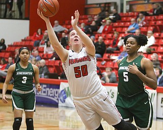  ROBERT K.YOSAY  | THE VINDICATOR..YSU #50 Anne Secrest as Binghamton #3Kai Moon and #5 Alyssa James look on..Anne was tripped up by Imani Watkins ( on the floor.. Leans and gets off a shot during first quarter action YSU Women went down to defeat against Binghamton 70-59  but not without a fight- The Penguins led by at least 10 at some point in the first half..-30-