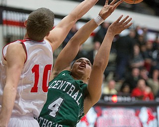 Labrae's Logan Kiser (10) blocks the shot of Central Catholic's Cortez Simmons (4) during the Division III regional semifinal at the Memorial Field House in Canton, OH on Wednesday, March 14, 2018. (CantonRep.com / Bob Rossiter)