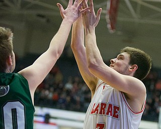 Labrae's Aaron Iler shoots over a Central Catholic's defender during the Division III regional semifinal at the Memorial Field House in Canton, OH on Wednesday, March 14, 2018. (CantonRep.com / Bob Rossiter)