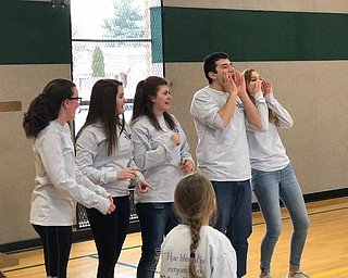 Some of the youth ministry members who participated recently during Catholic Schools week, above, from left, are Nola Argiro, Maddie Genova, Maria LoCicero, Mark Pompeo and Dani Scott, as they teach children the “Lent Song.”