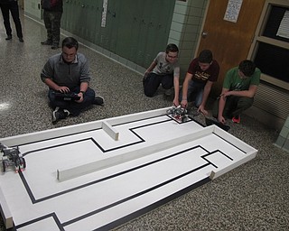 Neighbors | Zack Shively.The Boardman Robotics Team had a meeting during the Family STEAM Night, which allowed for families to learn about the team and organization.
