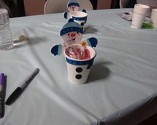 Neighbors | Zack Shively.The PTA had a craft table set up at the Father Daughter Dance where children decorated a cup and the PTA filled the cup with candy.