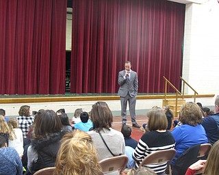 Neighbors | Zack Shively.Stadium Drive Elementary had an awards ceremony on Jan. 25 and 26. Principal Michael Zoccali laid down a red carpet for the students to walk when they got their awards. Pictured, Zoccali welcomed families to the Red Carpet Awards for the fourth-grade students.