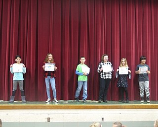 Neighbors | Zack Shively.Once the students walked the red carpet at Stadium Drive's award ceremony, they stood on stage and displayed their achievements. The parents then had an opportunity to take a photo of their children..