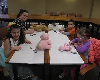 Neighbors | Zack Shively.10-year-old Avery Elise Sun illustrated the children's book "Andy Finds a Friend." The library set up a couple tables for other children to draw their favorite teddy bears. Pictured, from left front and moving clockwise, are Isabella Magura, Marissa Swantek, Christian Riley and Rylynn Stafford.
