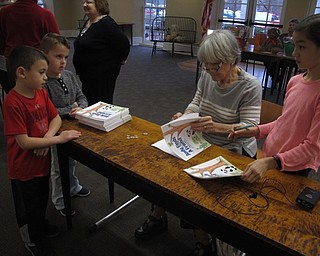 Neighbors | Zack Shively.The Teddy Bear Tea event had a basket raffle and a lunch for the families at the program. Families could also purchase Linda Brady Smith's book and get an autograph from her and her granddaughter, Avery Elise Sun, who illustrated the book. Pictured are, from left, John Ragan, Jack Miner, Smith and Sun.