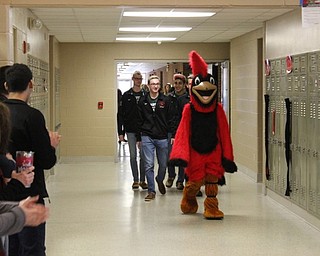 Neighbors | Abby Slanker.Led by Big Red, four members of the Canfield High School boys swim team who qualified to participate in the State Swim Meet were recognized with a traditional walk-though before traveling to compete in the Division II Boys State Swim Meet at the C.T. Branin Natatorium in Canton on Feb. 23.