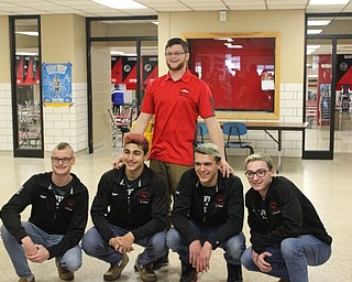 Neighbors | Abby Slanker.Members of the Canfield High School boys swim team, coached by Connor Brady (back) were recognized with a walk-through at the school before traveling to compete in the Division II Boys State Swim Meet at the C.T. Branin Natatorium in Canton. Team members included, from left, senior Cullen Brady, senior Kamran Sarac, junior Jason Paris and junior Bobby Kutsch.