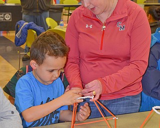 Third-grade teacher Kim Kolidakis helps kindergarten student Frankie Rossodivita with an arts-and-crafts activity at Campbell Community Night at Campbell K-7 School on Thursday, March 15, 2018...Photo by Scott Williams - The Vindicator.