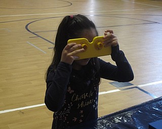 Neighbors | Zack Shively.The Center for Science and Industry (COSI) Columbus visited Austintown Elementary School on March 7-9 to teach children about ecology. They had stations centered around the topic, including one that allowed the students to see like certain animals do.