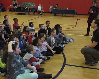 Neighbors | Zack Shively.Lindy Newman of COSI gave an assembly presentation on ecology. Each day a different grade level had the assembly and visited the gym later for stations. Before they could go to the stations, Newman explained the rules to them and answered their questions about the stations.