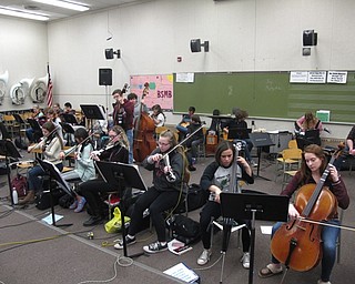 Neighbors | Zack Shively.Michele Prokop, Bill Amendol and Joel Monaco direct the Project Mayhem orchestra. They play songs from a range of years and genres, such as 1976's "Carry on Wayward Son" by classic rock band Kansas and 2018's "Havana" by pop singer Camila Cabello. Pictured, the band practiced Coheed and Cambria's progressive rock song "Welcome Home" from 2005 on March 7.