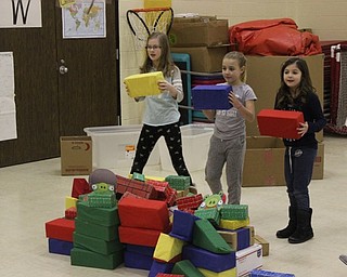 Neighbors | Abby Slanker.A group of Hilltop Elementary School third-grade students waited to see if a ball launched from a catapult would knock down the structure they had built at an engineering station during the school’s annual STEM Week on March 8.