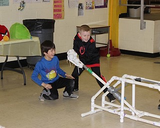 Neighbors | Abby Slanker.A group of Hilltop Elementary School third-grade students prepared to launch items at a structure built by their classmates at an engineering station during the school’s annual STEM Week.