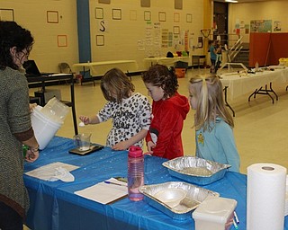 Neighbors | Abby Slanker.At a science station, Hilltop Elementary School third-grader measured materials to create instant snow during the school’s annual STEM Week on March 8.
