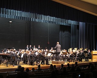 Neighbors | Zack Shively.Jeff Hvizdos and Jeff Penny directed different songs for both the Poland symphonic band and wind ensemble. Pictured, Penny led the wind ensemble for the song “The Crosley March,“ by Henry Fillmore.