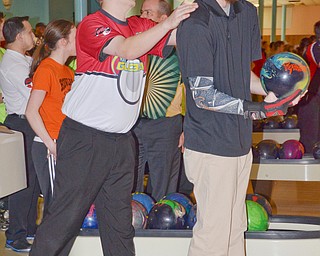 Pro bowler Brian Robinson, from Morgantown, WV, lays a helping hand on Tyler Luoma from Cortland as he prepares to bowl at Bell Wick Bowling Alley in Hubbard, Ohio on March 16, 2018...Photo by Scott Williams - The Vindicator.