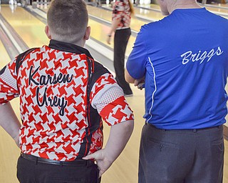 Karsen Urey, left, from Greenville High School, listens to some advice from pro bowler Dennis Briggs from Beaver Falls, PA at Bell Wick Bowling Alley in Hubbard, Ohio on March 16, 2018...Photo by Scott Williams - The Vindicator.