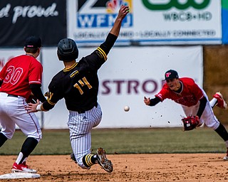 THE VINDICATOR | DIANNA OATRIDGE..Youngstown State shortstop Cody Dennis (10) flips the ball to second baseman Drew Dickerson (30) as Milwaukee's Mitch Buban slides into second during the first game of their Horizon League double header at Eastwood Field on Saturday.Ê