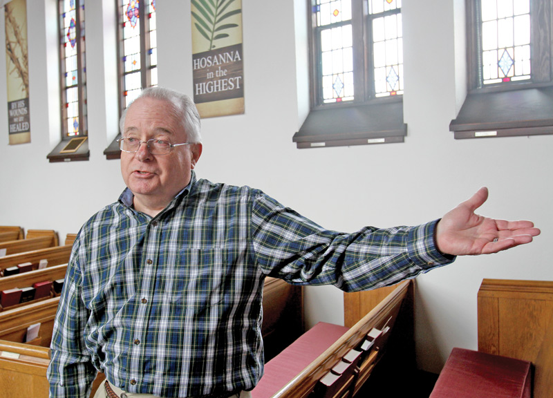 The Rev. Dick Smith stands in the sanctuary of Brookfield United Methodist Church and talks about the robbery that happened in late January. There was an outpouring of donations from the community following the robbery, and he talks about it in his sermons.
