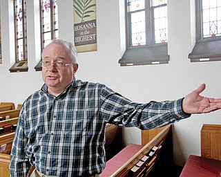 The Rev. Dick Smith stands in the sanctuary of Brookfield United Methodist Church and talks about the robbery that happened in late January. There was an outpouring of donations from the community following the robbery, and he talks about it in his sermons.