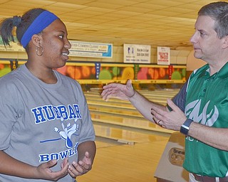 Hubbard High School senior Alexis Cobbin listens to advice from pro bowler Steve Haas from Enola, Pa., on Friday at Bell-Wick Bowl in Hubbard. Students received instructions from the pros before a pro-am event.